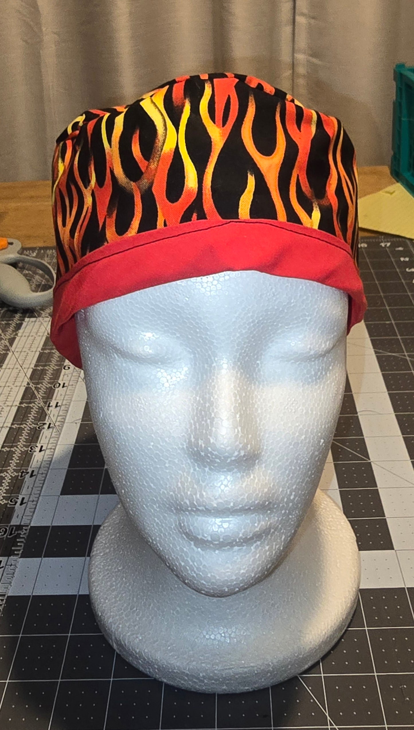 Scrub hat, skullcap style. Flames